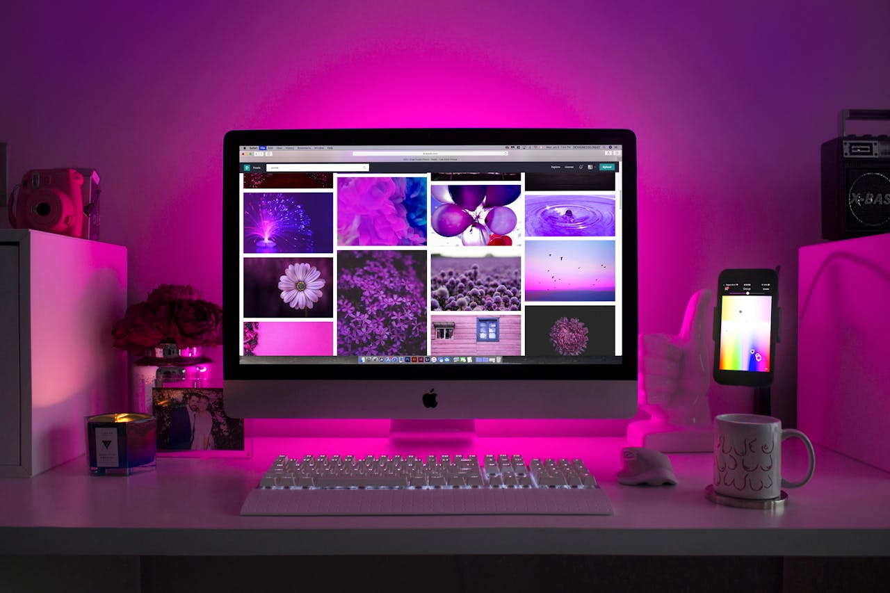 Mastering the First Impression: Your intriguing post title goes here Modern desk setup with neon lighting and a desktop computer displaying colorful images.